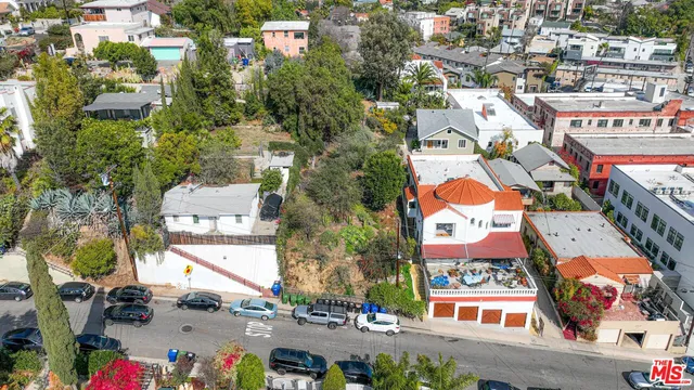 an aerial view of residential houses with outdoor space