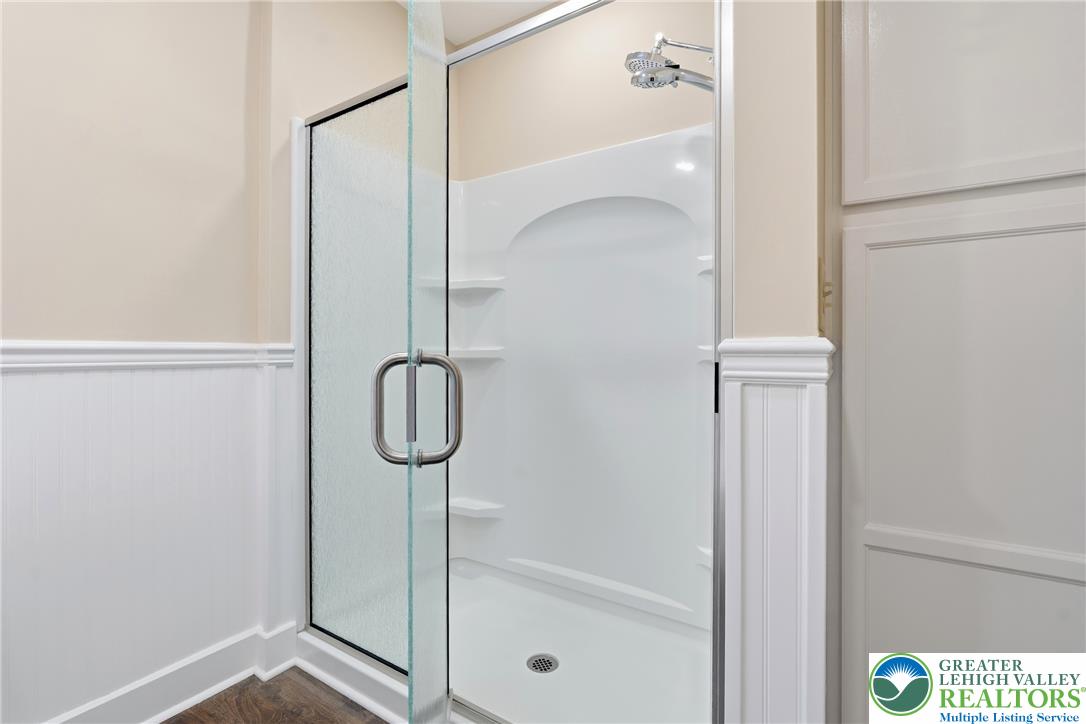 4682 Steuben Road Bethlehem, PA 18020 - Photo 36 of 79 A glass-enclosed shower stall with a dual shower head provides a refreshing bathing experience.