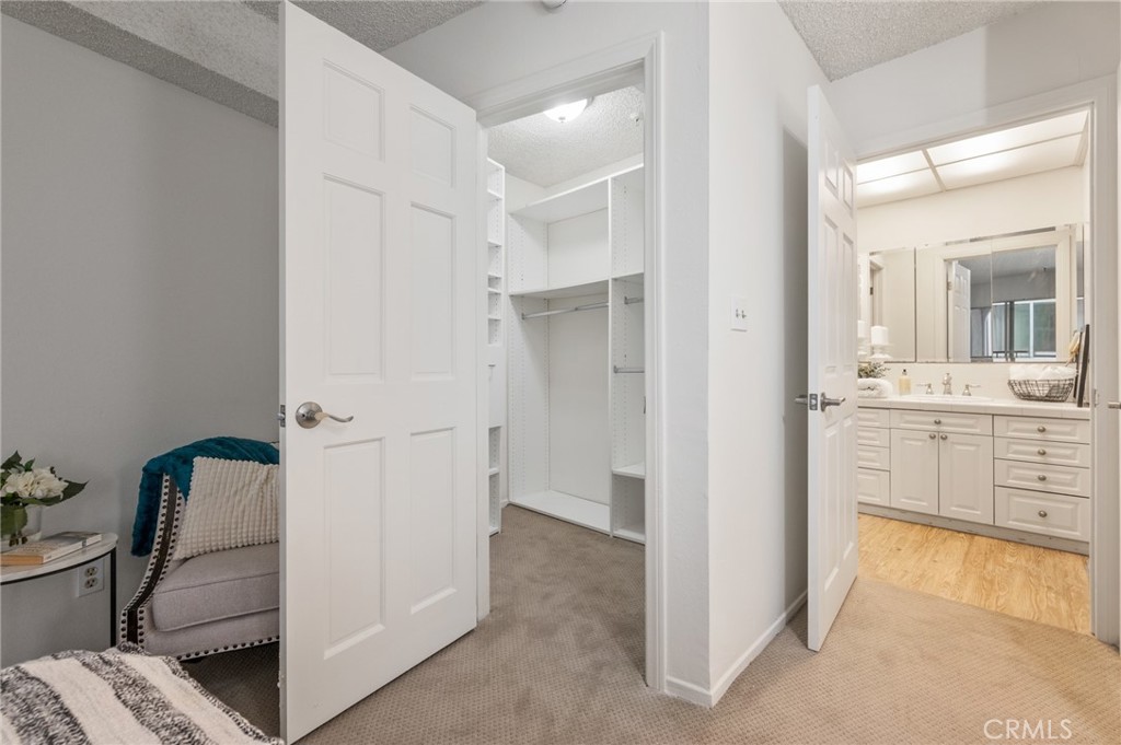 565 Esplanade, Unit 104 Redondo Beach, CA 90277 - Photo 27 of 42 a bathroom with a sink and mirror