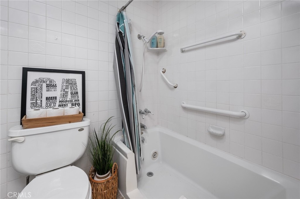 565 Esplanade, Unit 104 Redondo Beach, CA 90277 - Photo 28 of 42 a white toilet sitting next to a bath tub