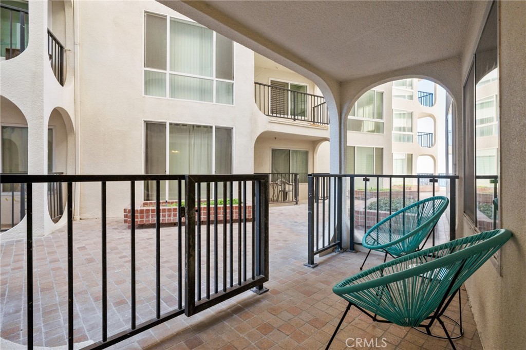 565 Esplanade, Unit 104 Redondo Beach, CA 90277 - Photo 32 of 42 a view of a chair and table in the balcony