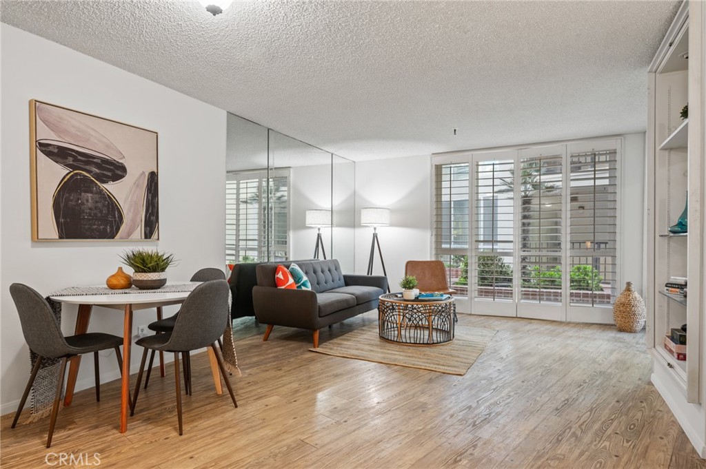 565 Esplanade, Unit 104 Redondo Beach, CA 90277 - Photo 7 of 42 a living room with furniture and a large window