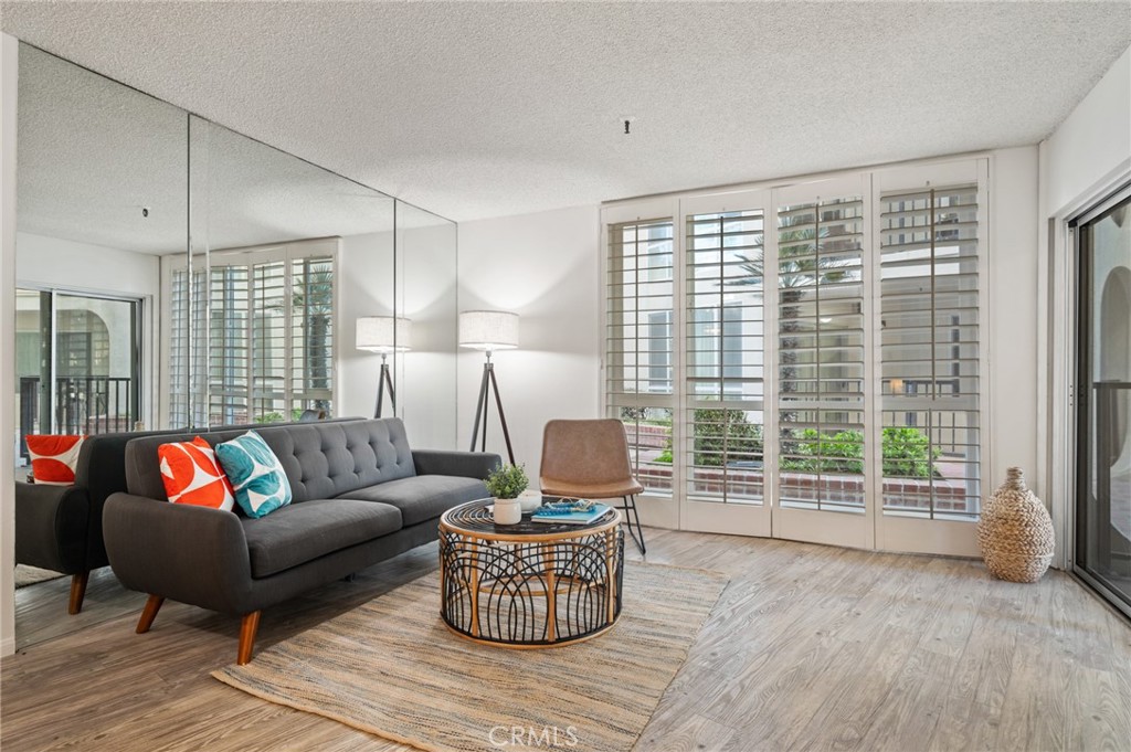 565 Esplanade, Unit 104 Redondo Beach, CA 90277 - Photo 9 of 42 a living room with furniture and a large window