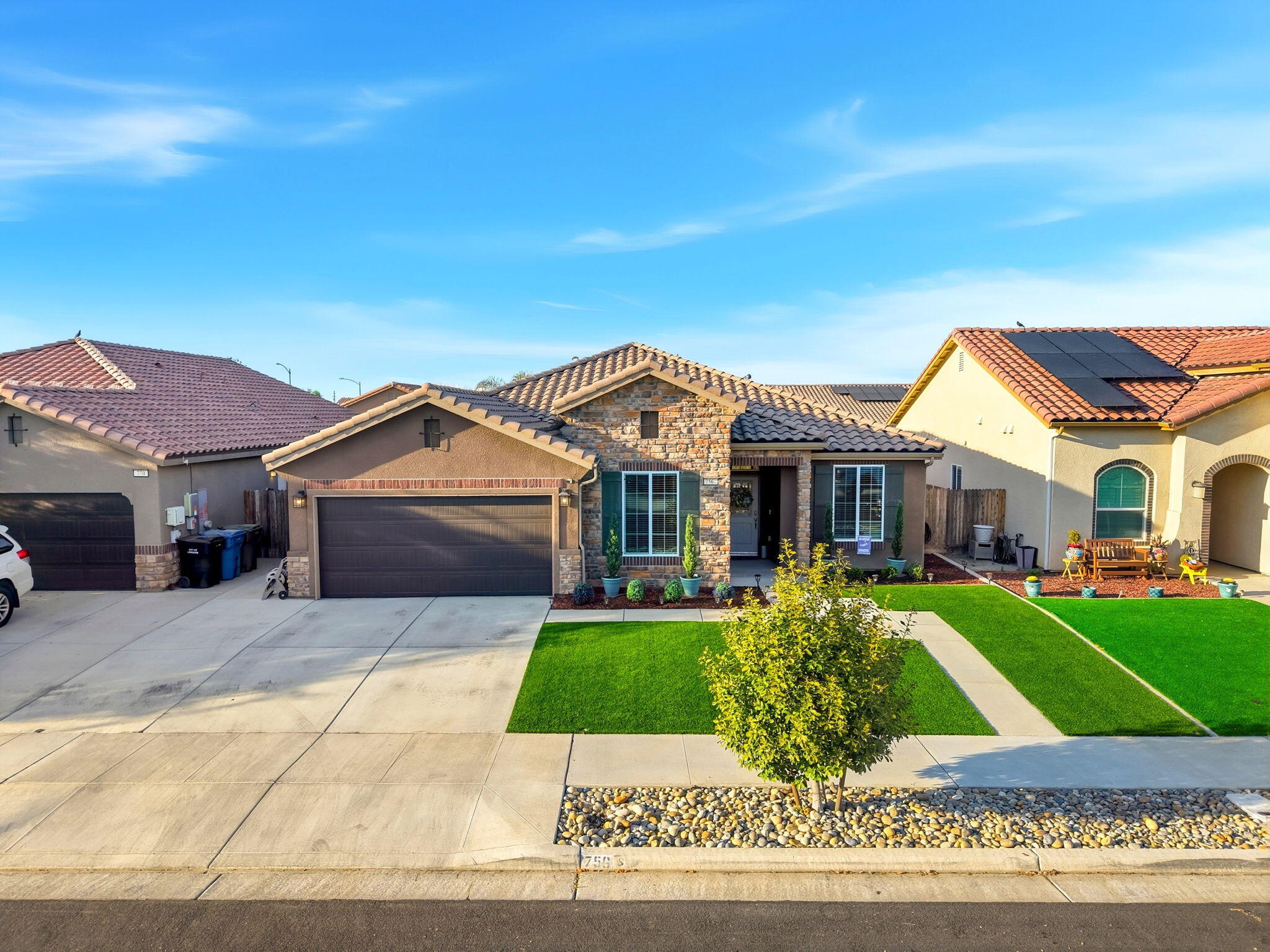 756 Strada Street Lemoore, CA 93245 - Photo 50 of 53 a front view of a house with a yard
