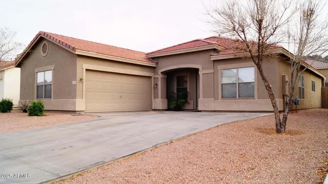 a front view of a house with garage