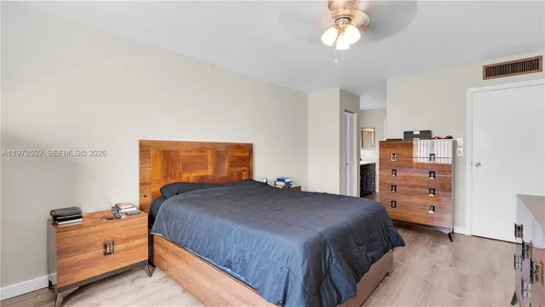 a bedroom with a bed and a dresser