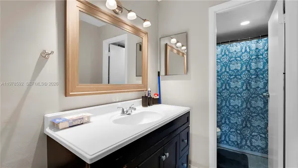 a city street lined with buildings and trees