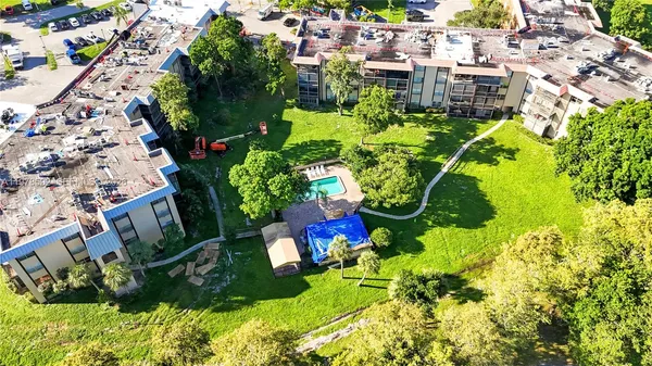 a utility room with cabinets washer and dryer