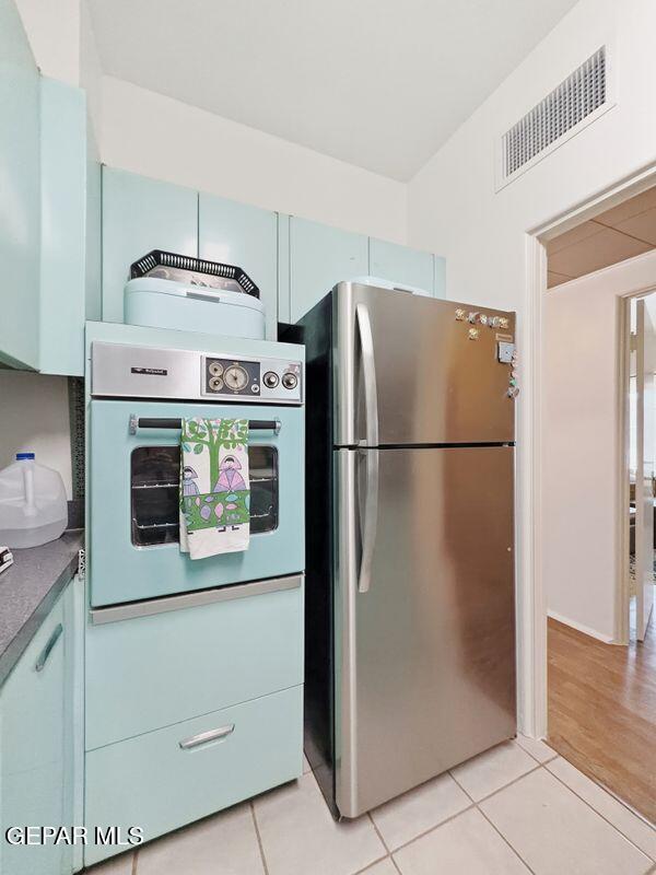 4135 Emory Road El Paso, TX 79922 - Photo 64 of 73 a kitchen with cabinets and stainless steel appliances