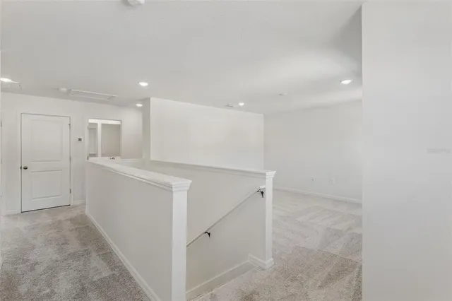 a view of a hallway with closet
