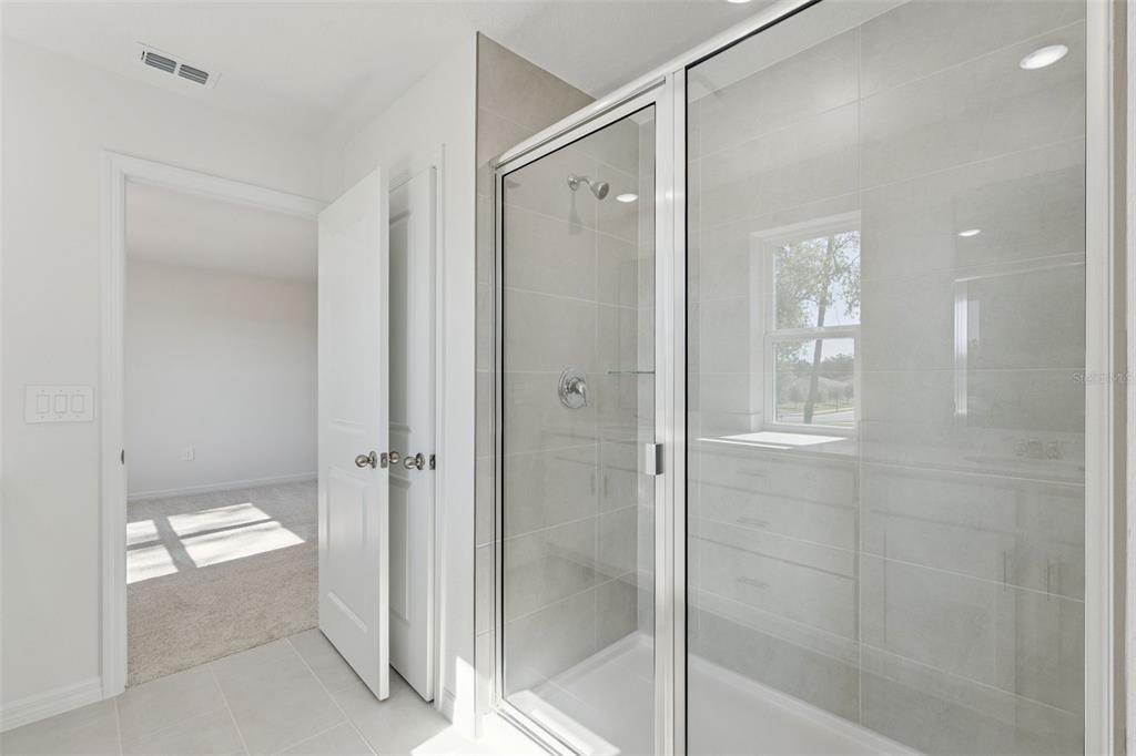 4295 Darby Court Eustis, FL 32736 - Photo 17 of 25 a bathroom with a shower and a toilet