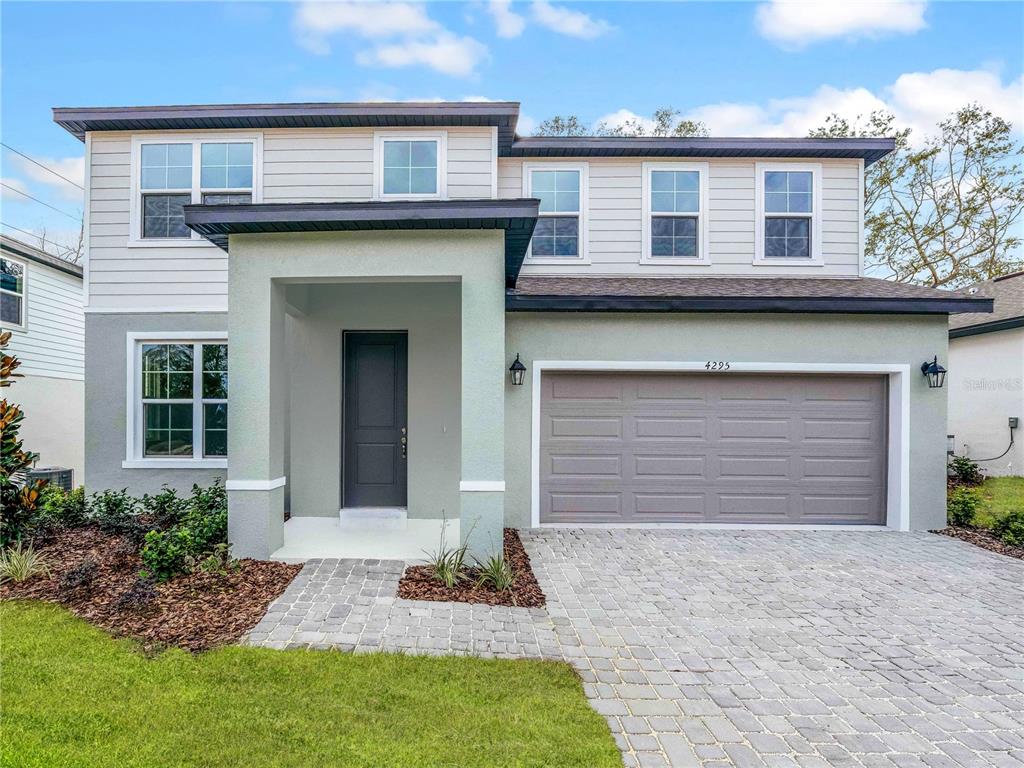 4295 Darby Court Eustis, FL 32736 - Photo 2 of 25 a front view of a house with garden