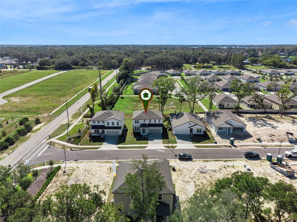 4295 Darby Court Eustis, FL 32736 - Photo 23 of 25 an aerial view of a house with a garden