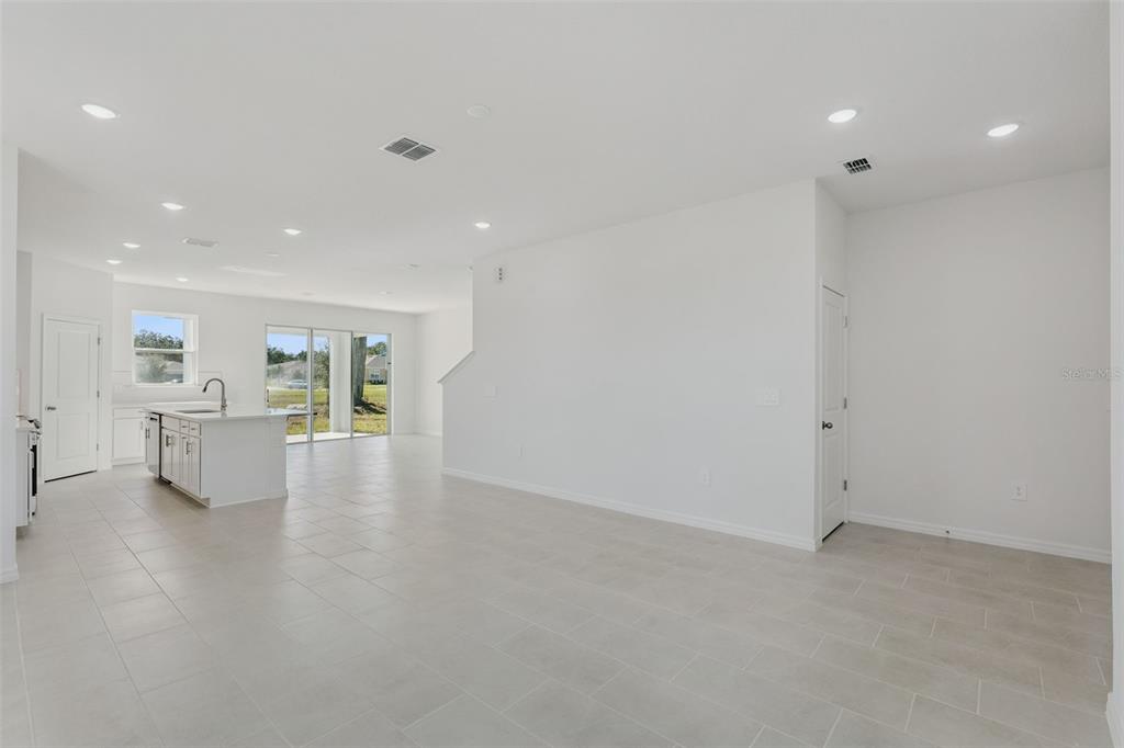 4295 Darby Court Eustis, FL 32736 - Photo 4 of 25 a view of a living room and kitchen with furniture