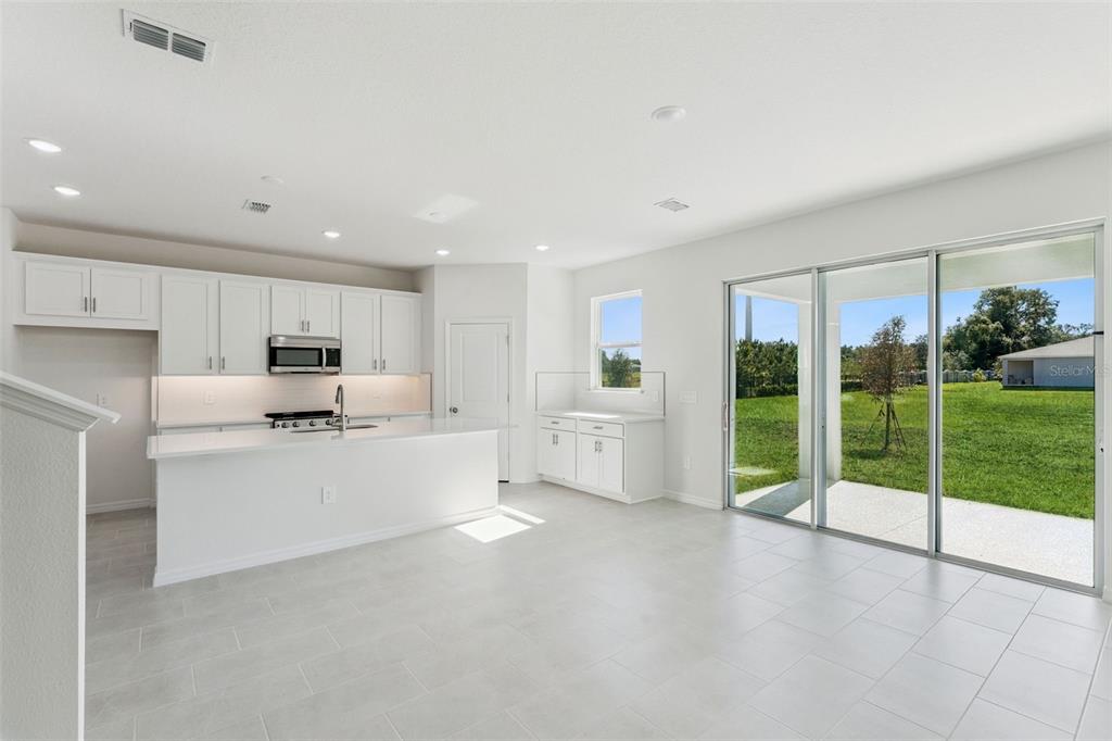 4295 Darby Court Eustis, FL 32736 - Photo 5 of 25 a large white room with a large window