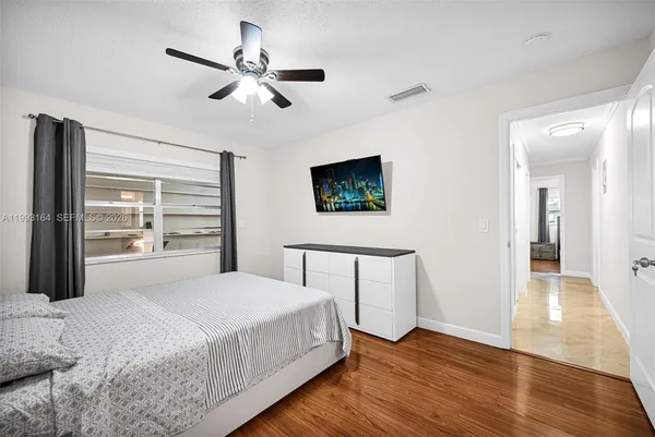 a bedroom with a bed and a table