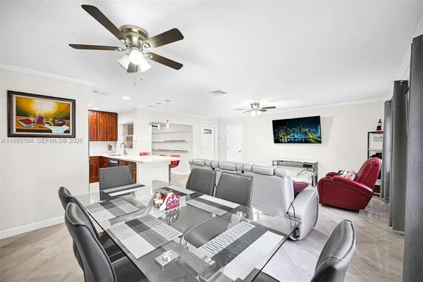 a living room with furniture and flat screen tv
