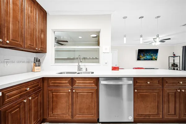 a kitchen with a sink and cabinets
