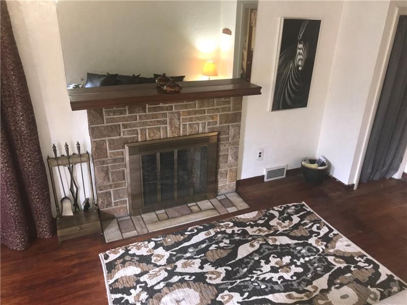 1518 Collins Road Pittsburgh, PA 15221 - Photo 6 of 25 Living Room - Stone Fire Place, Log Burning....