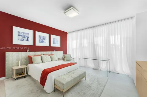 a bed room with a bed and a window