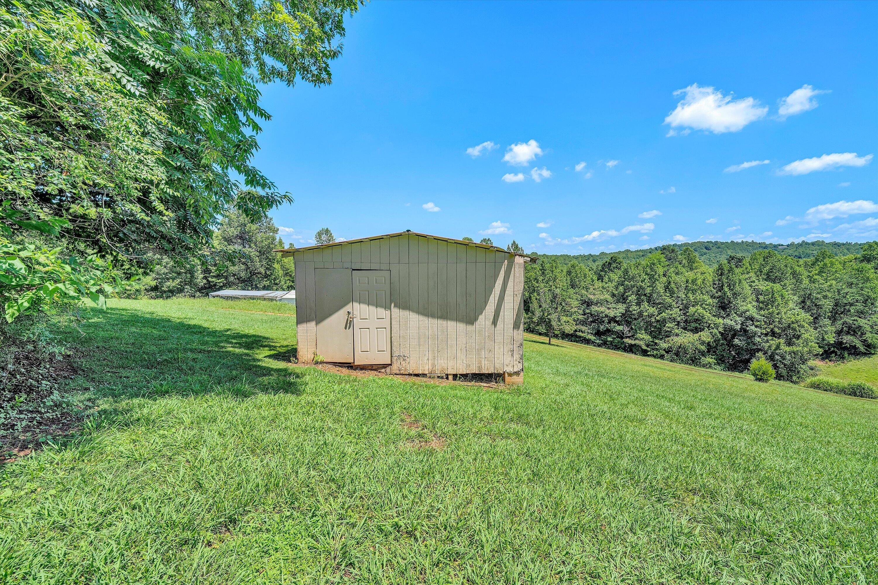 602 Power Dam Road Rocky Mount, VA 24151 - Photo 24 of 34 a view of a tiny house with a yard