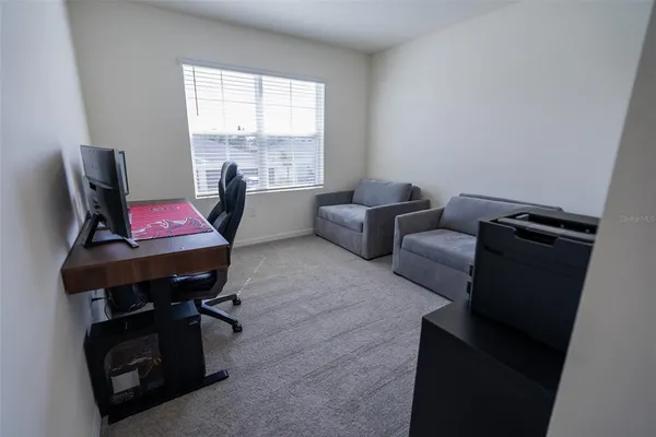a living room with furniture and a rug