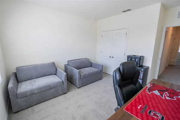 a living room with furniture and a window