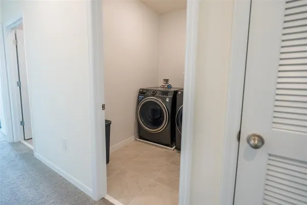 a bathroom with a sink a toilet and shower curtain
