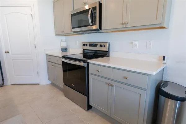 a kitchen with a sink and a microwave