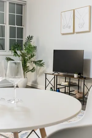 a living room with furniture and a flat screen tv