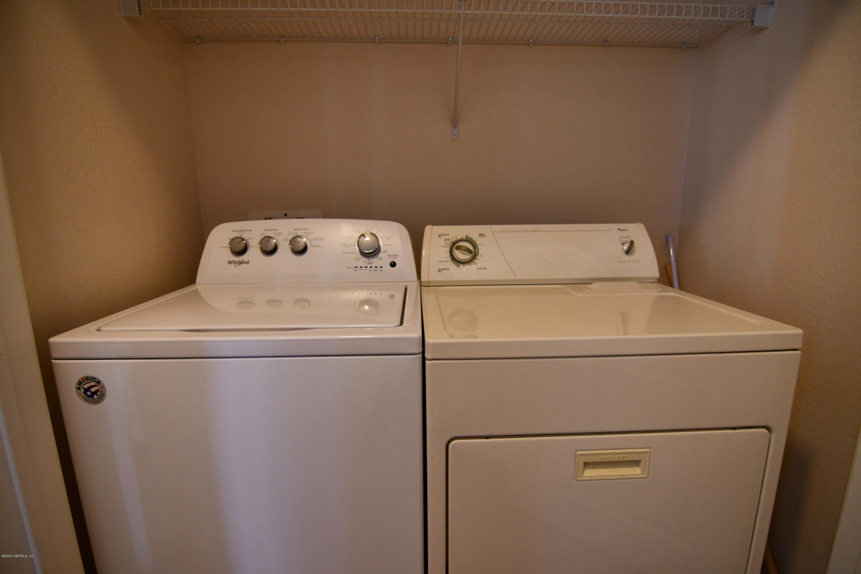 8290 Gate Parkway West, Unit 206 Jacksonville, FL 32216 - Photo 12 of 19 a utility room with dryer and washer