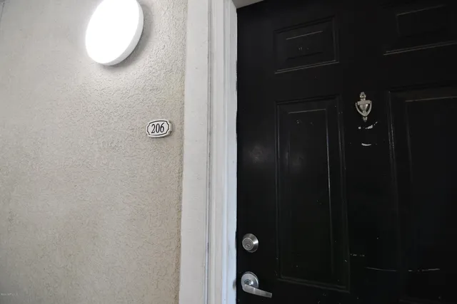 a bathroom with a mirror and a shower