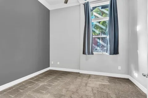 a view of an empty room and window