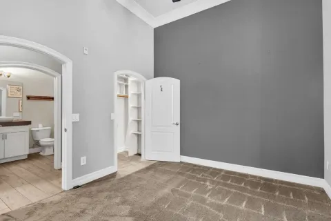a view of room with walk in closet and window