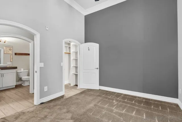 a view of room with walk in closet and window