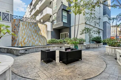 a view of a patio with a table and chairs