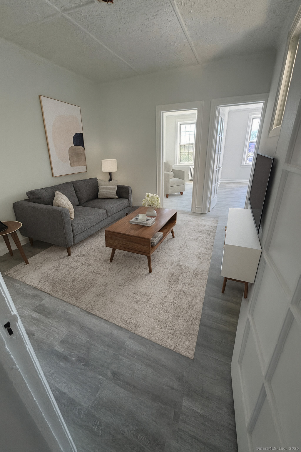 351 Greenwich Avenue, Unit 3 Greenwich, CT 06830 - Photo 3 of 8 a living room with furniture and a flat screen tv