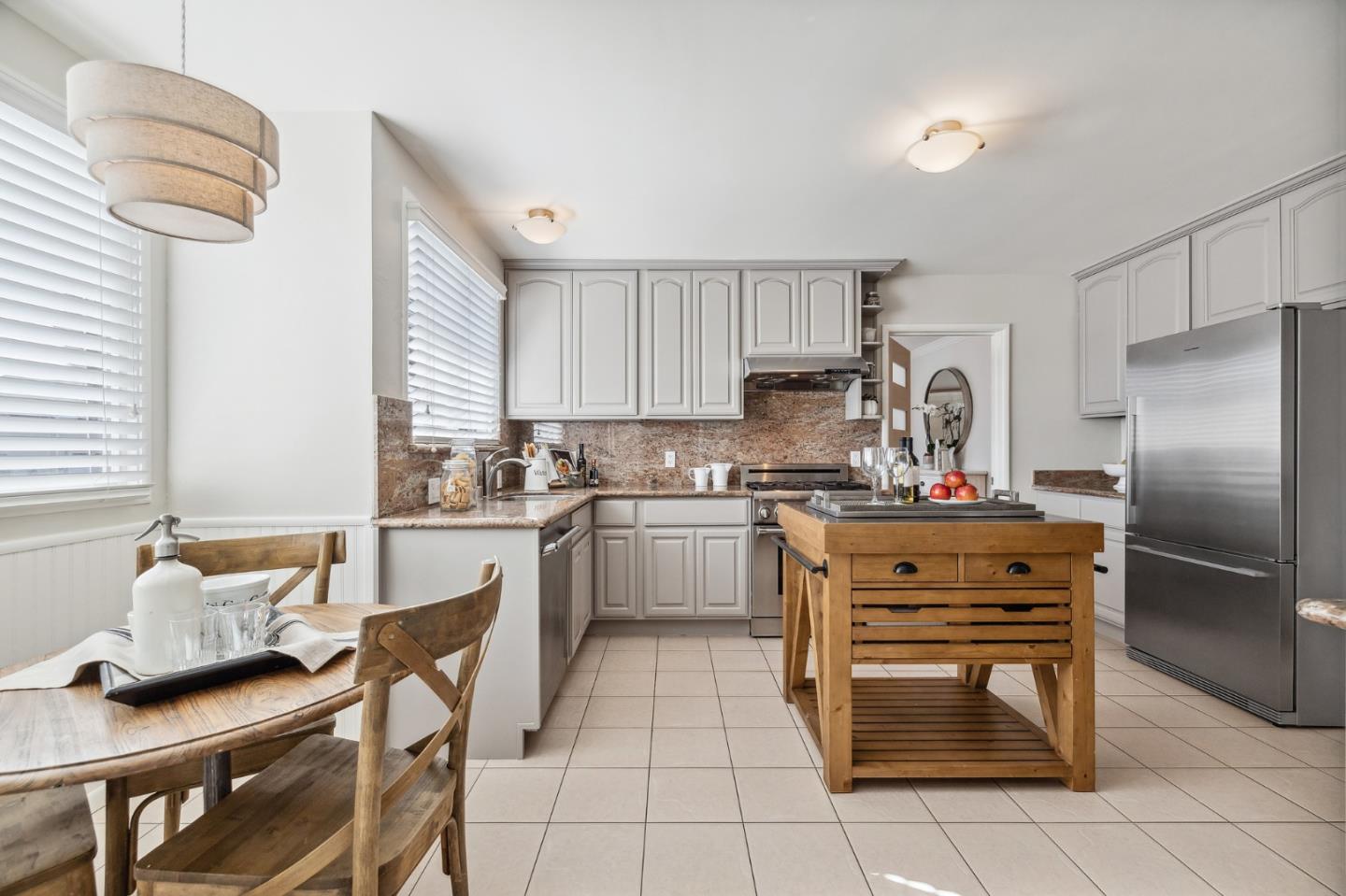 86 Cliffside Drive Daly City, CA 94015 - Photo 16 of 50 a kitchen with stainless steel appliances granite countertop a refrigerator sink and cabinets