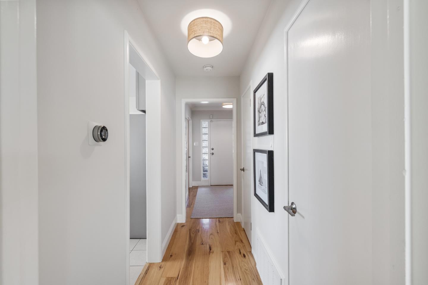 86 Cliffside Drive Daly City, CA 94015 - Photo 19 of 50 a view of a hallway with wooden floor