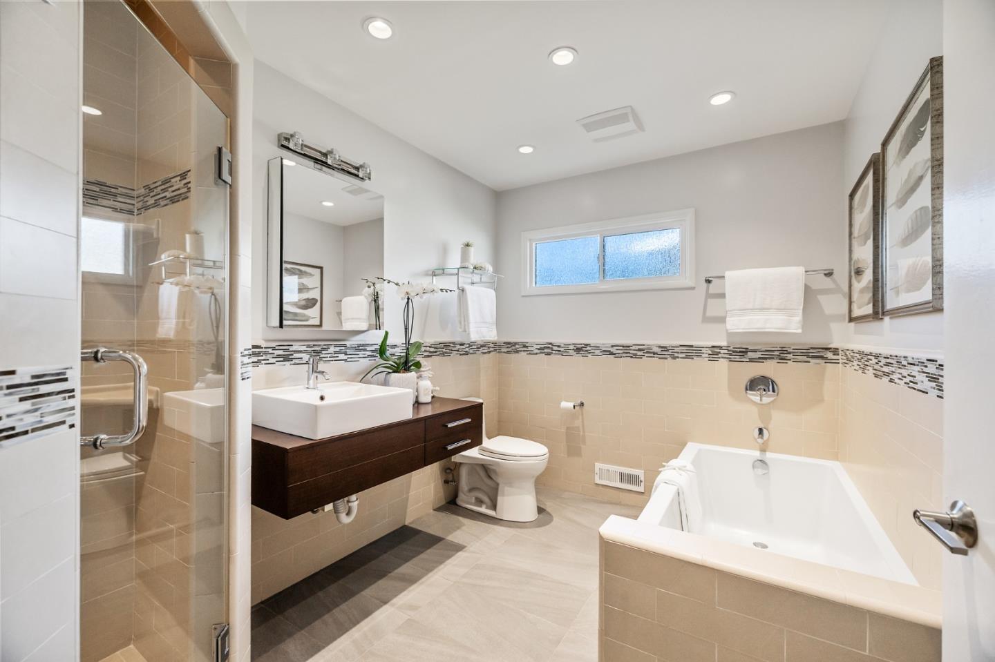 86 Cliffside Drive Daly City, CA 94015 - Photo 39 of 50 a bathroom with a double vanity sink mirror and bathtub