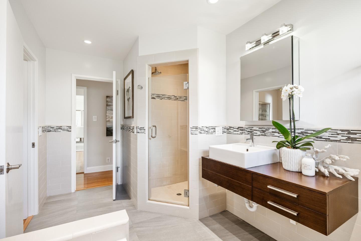 86 Cliffside Drive Daly City, CA 94015 - Photo 40 of 50 a spacious bathroom with a double vanity sink a mirror and a bathtub
