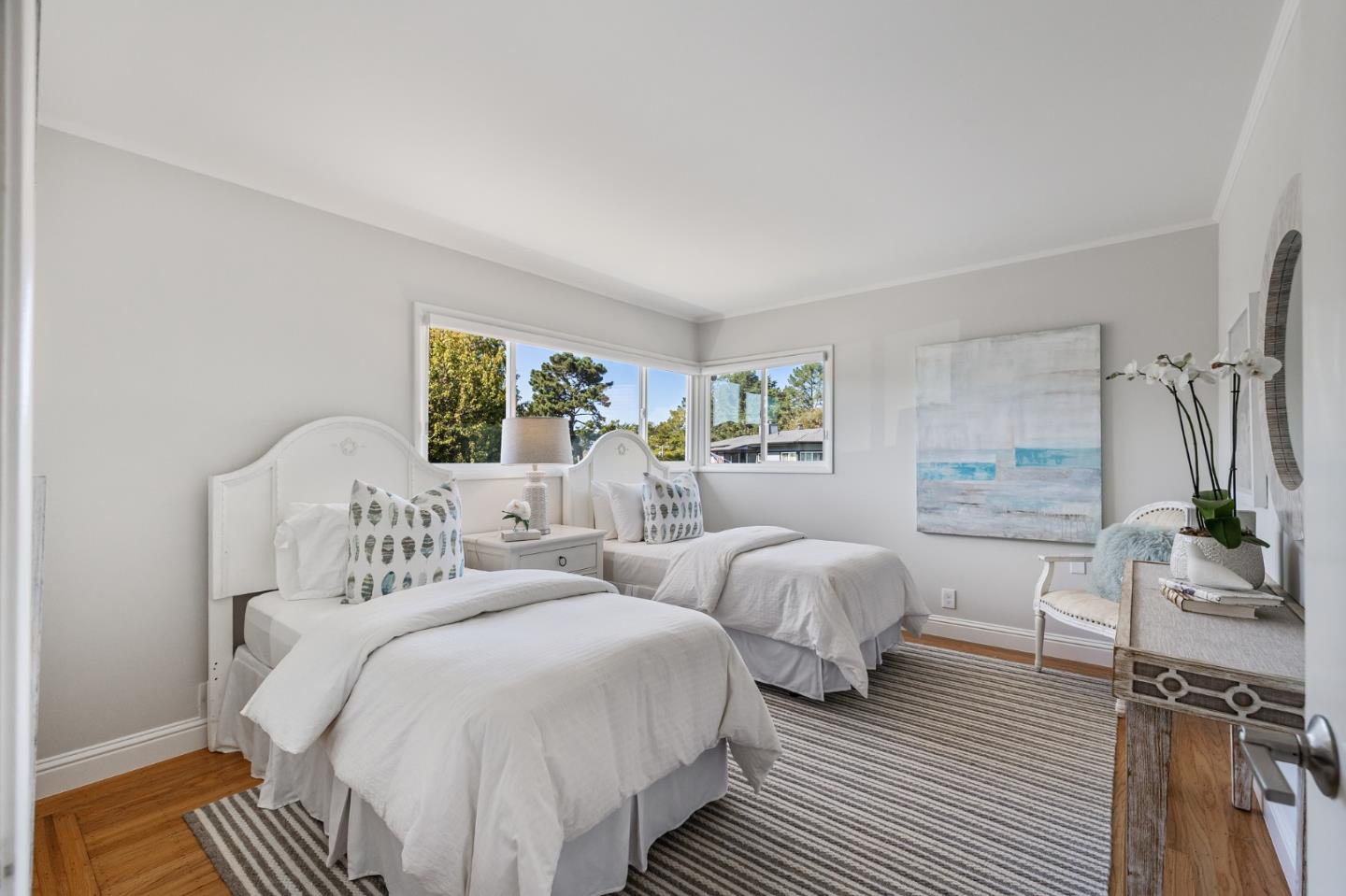 86 Cliffside Drive Daly City, CA 94015 - Photo 42 of 50 a bedroom with two beds and a potted plant next to a window