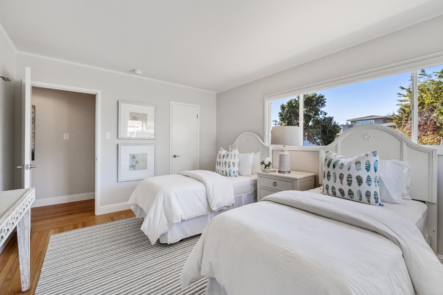 86 Cliffside Drive Daly City, CA 94015 - Photo 43 of 50 a bedroom with two beds and potted plants with wooden floor