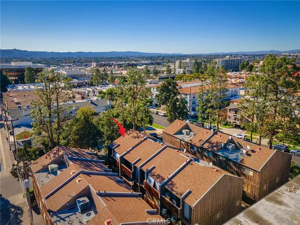 an aerial view of a house with a ocean view