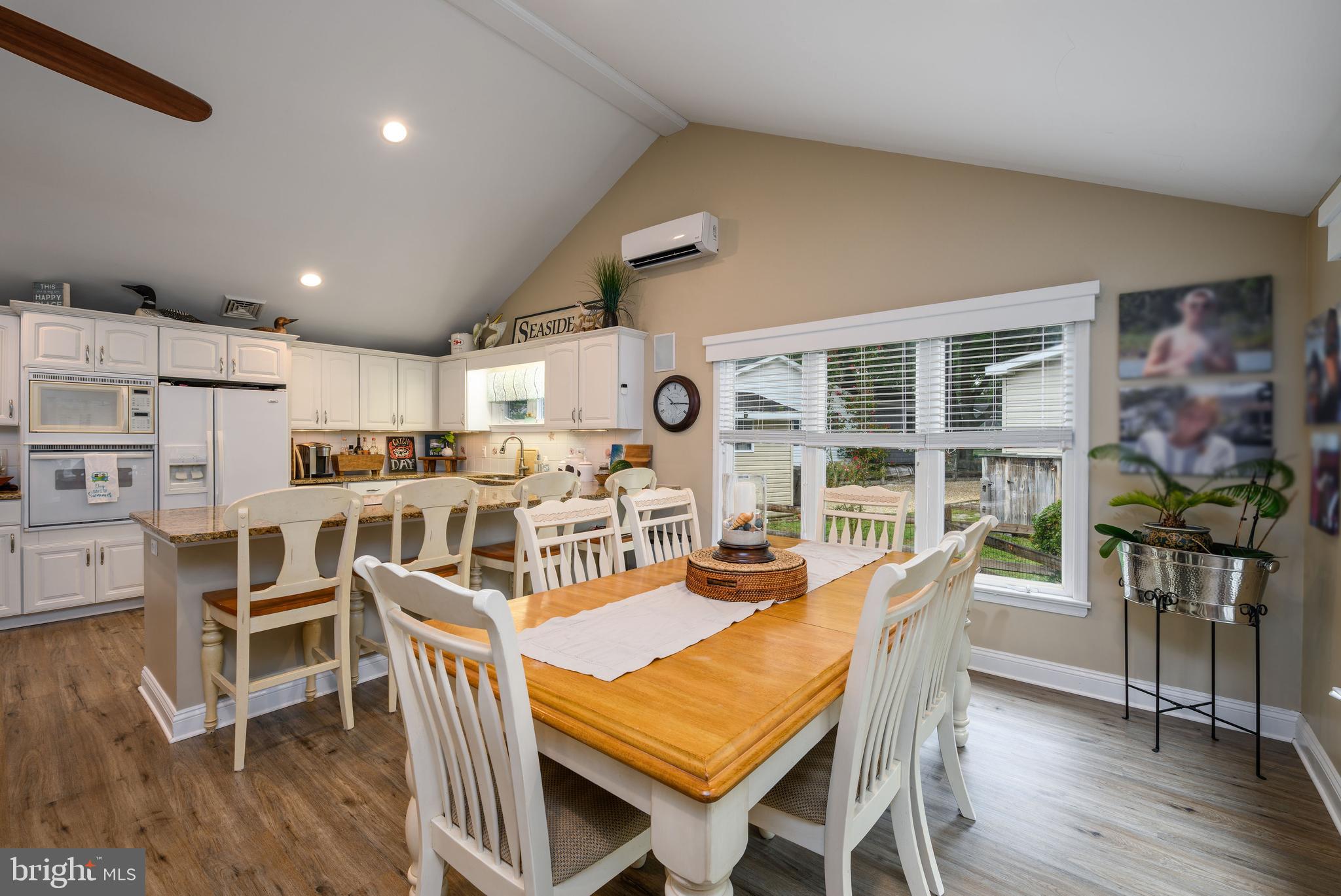 34386 Mallard Road, Unit 482 Long Neck, DE 19966 - Photo 12 of 41 a dining room with furniture and wooden floor