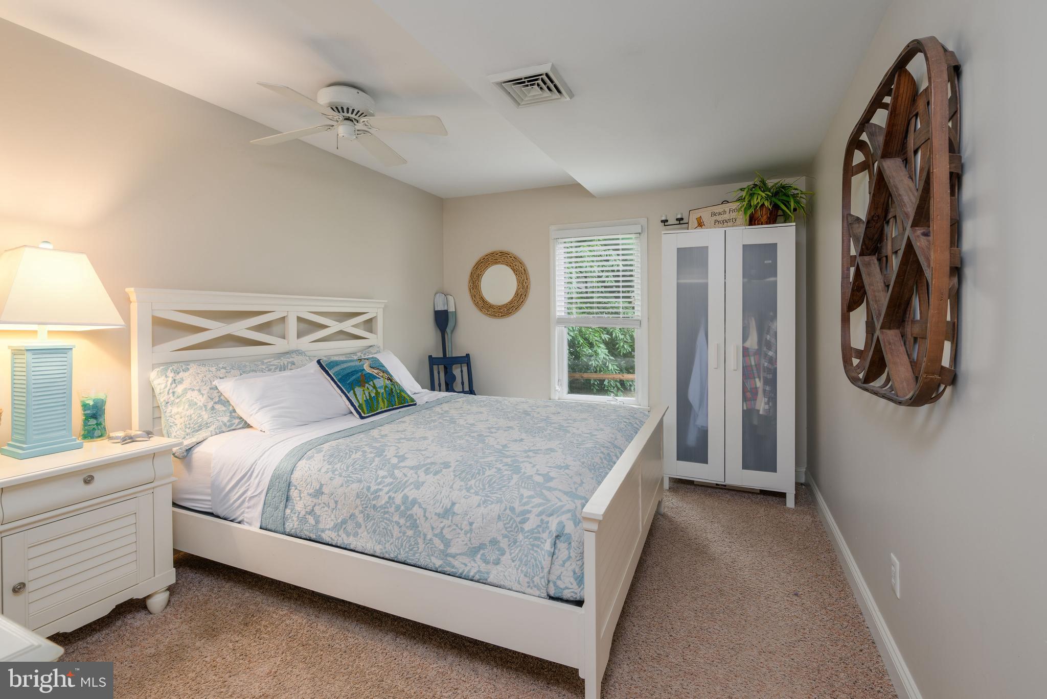 34386 Mallard Road, Unit 482 Long Neck, DE 19966 - Photo 18 of 41 a bedroom with a bed and a window