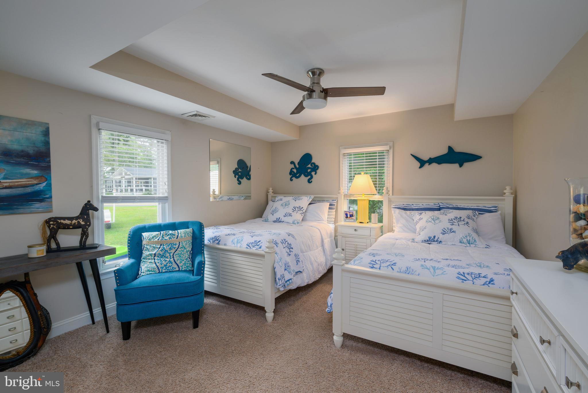 34386 Mallard Road, Unit 482 Long Neck, DE 19966 - Photo 24 of 41 a bedroom with two beds and a couch