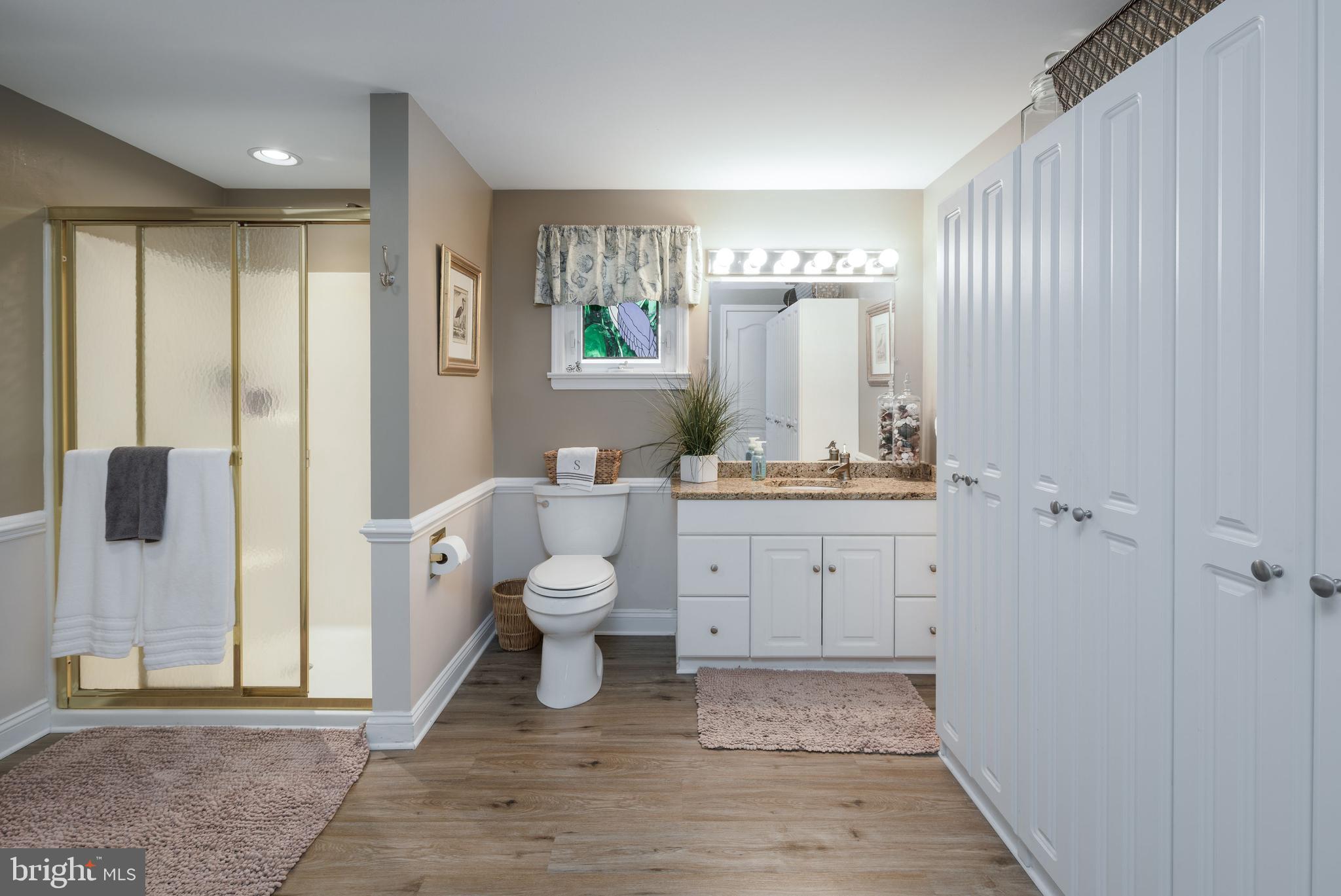 34386 Mallard Road, Unit 482 Long Neck, DE 19966 - Photo 28 of 41 a bathroom with a sink and a mirror