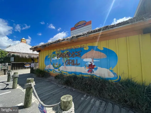 a view of a park with swings and slides