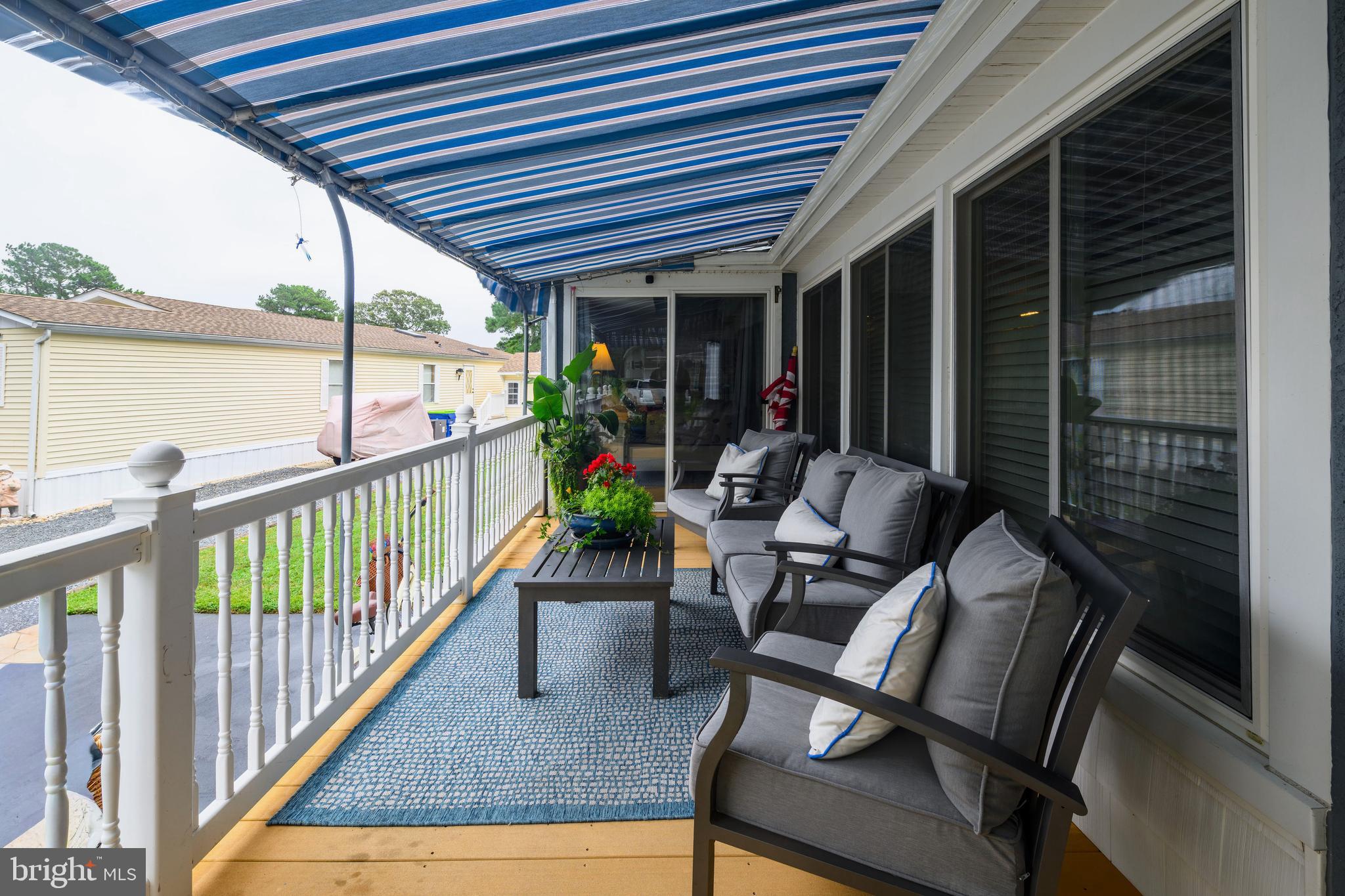 34386 Mallard Road, Unit 482 Long Neck, DE 19966 - Photo 6 of 41 a view of two chairs in the balcony